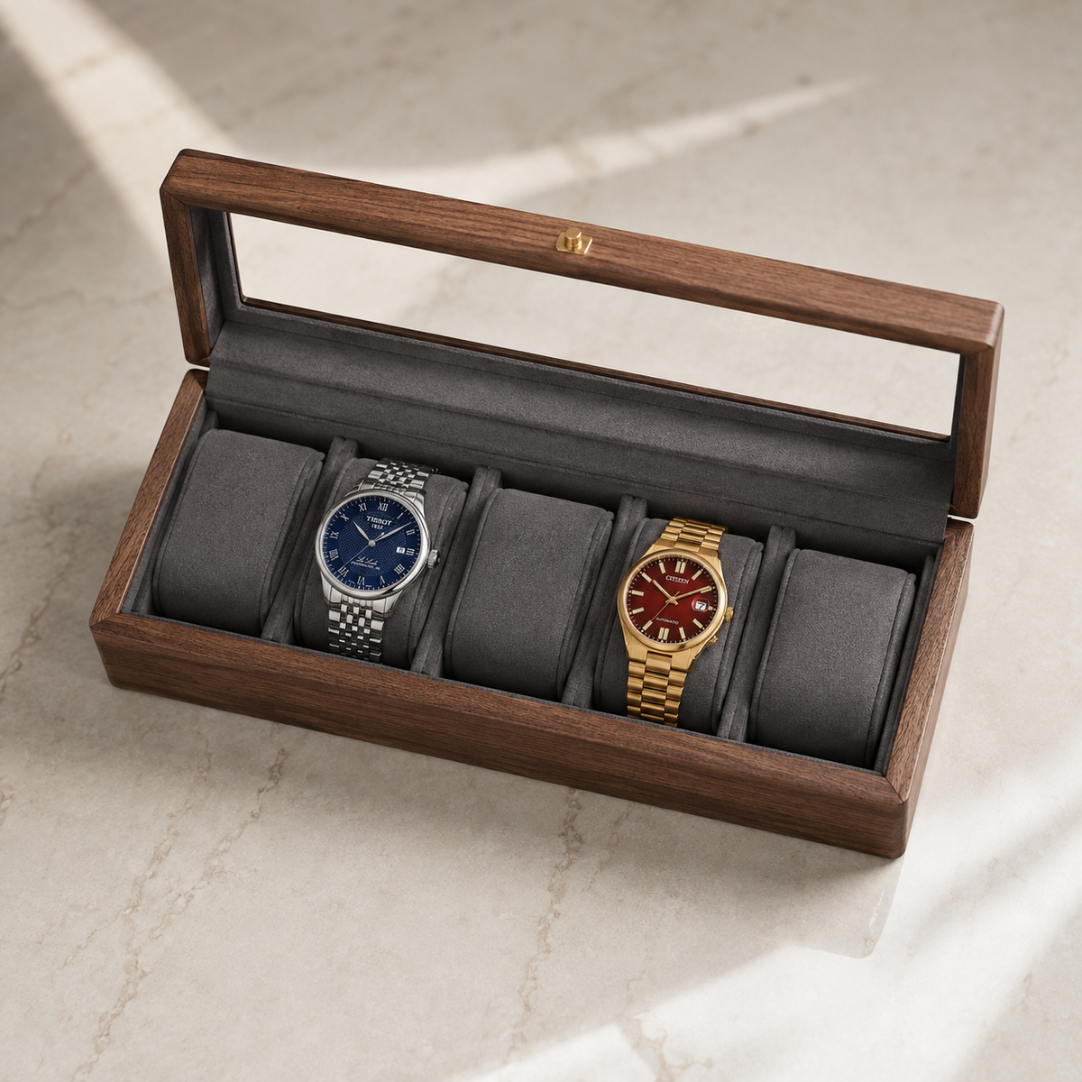 Pollux five-slot box open in a room setting, brass latch swung clear of the lid