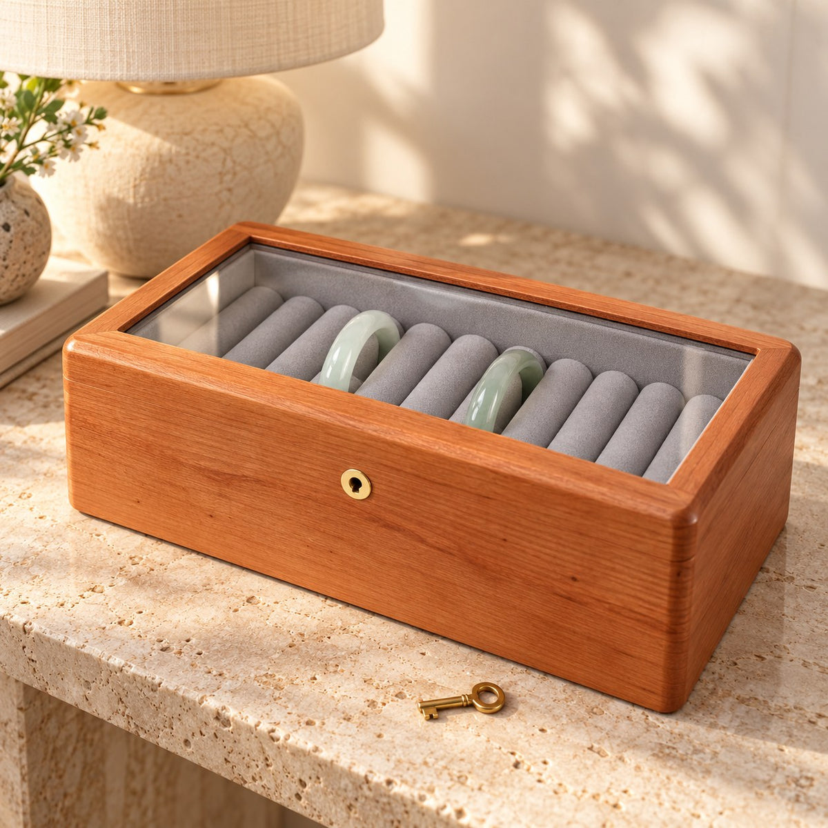 Armilla Glass Bangle Box in Cherry / Glass Lid / 10 Slots, on a sideboard in natural light #Wood_Cherry|Style_Glass Lid|Size_10 Slots