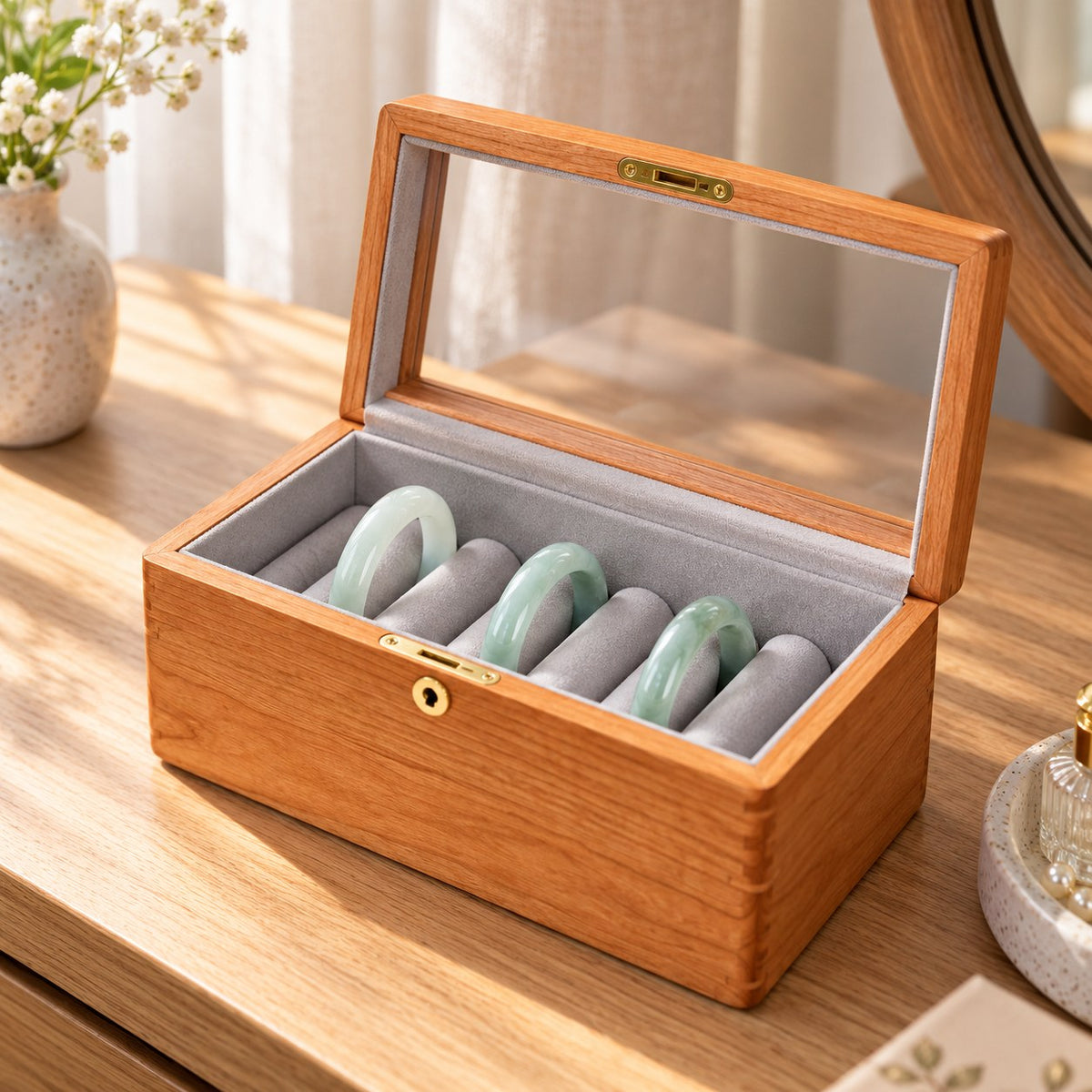 Armilla Glass Bangle Box in Cherry / Glass Lid / 6 Slots, on a dressing table #Wood_Cherry|Style_Glass Lid|Size_6 Slots
