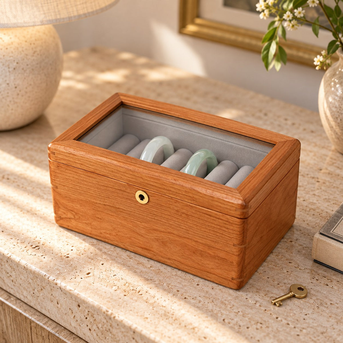 Armilla Glass Bangle Box in Cherry / Glass Lid / 6 Slots, on a sideboard in natural light #Wood_Cherry|Style_Glass Lid|Size_6 Slots