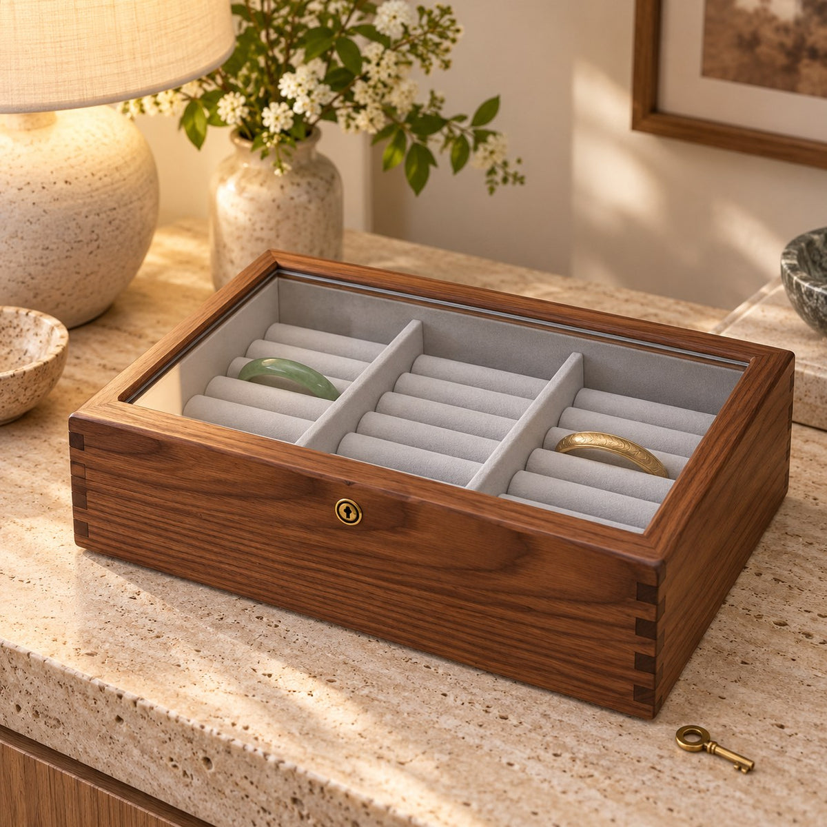 Armilla Glass Bangle Box in Walnut / Glass Lid / 18 Slots, on a sideboard in natural light #Wood_Walnut|Style_Glass Lid|Size_18 Slots