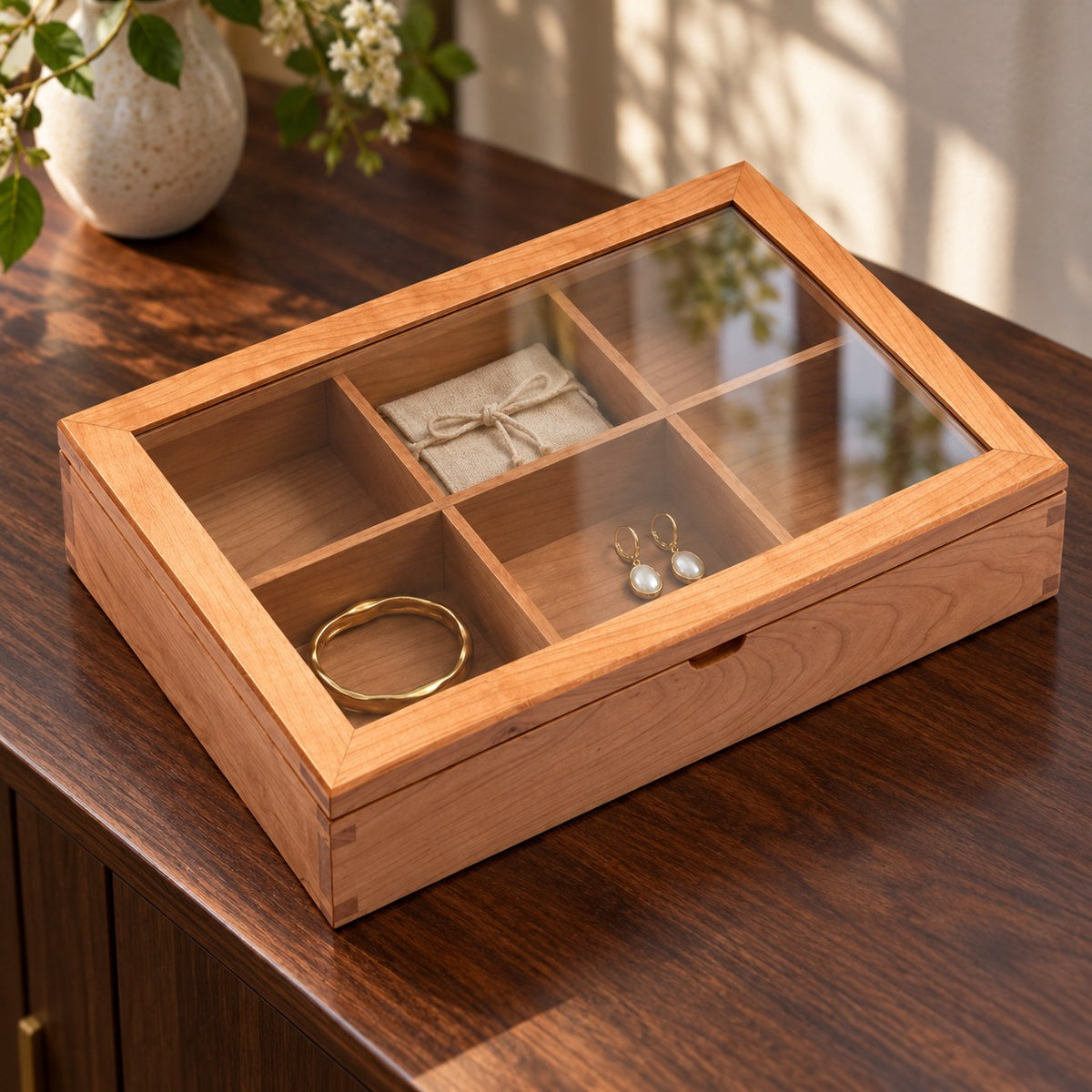 Hyalina Glass Jewellery Box in Cherry / 6-Slot, on a sideboard in natural light #Wood_Cherry|Size_6-Slot